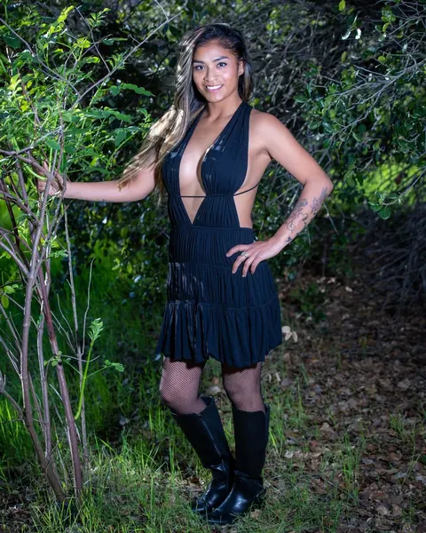 Latina with Short Curly Hair Poses in Boots Outdoors – photo 8 of 12
