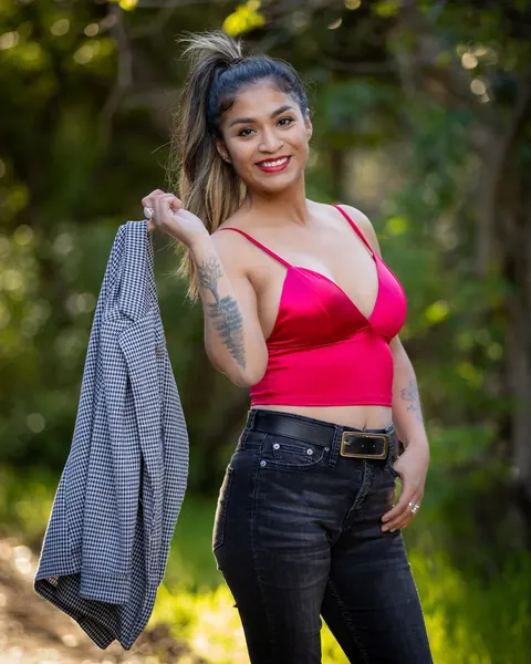 Latina with Short Curly Hair Poses in Boots Outdoors – photo 9 of 12