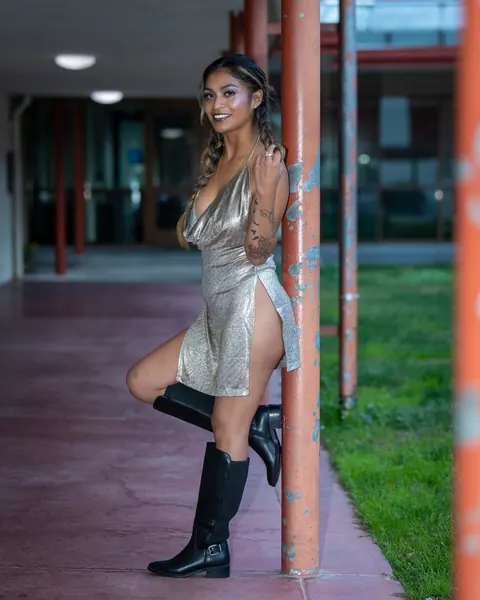 Latina with Short Curly Hair Poses in Boots Outdoors – photo 6 of 12