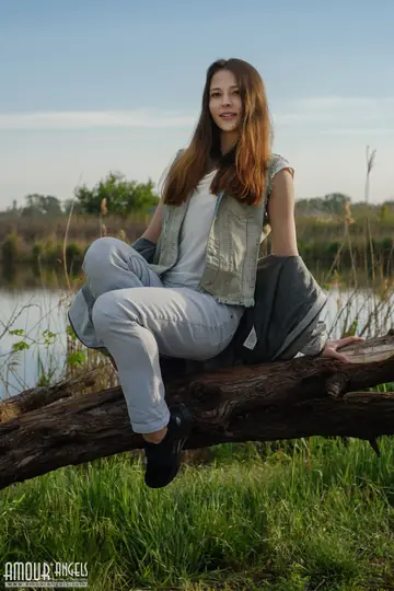 Redhead Strips Out of Her Jeans Outdoors by the Water