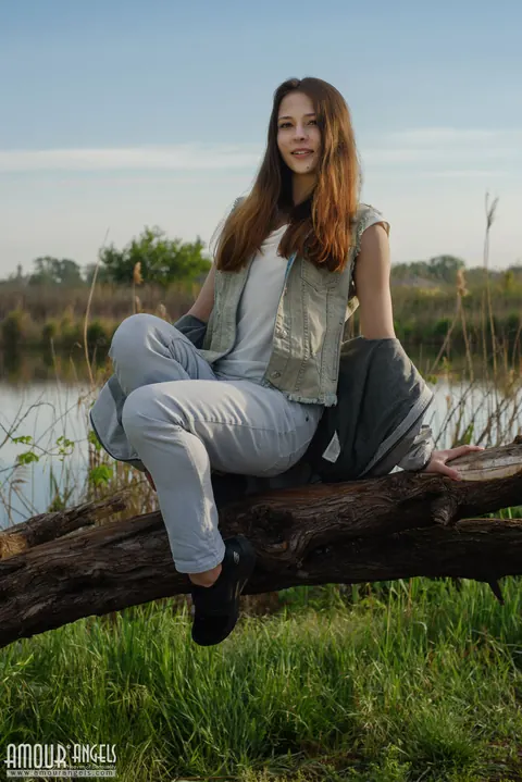 Redhead Strips Out of Her Jeans Outdoors by the Water – photo 1 of 20