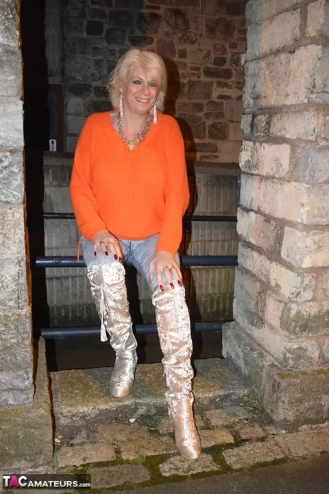 Mature Blonde in Lingerie, Jeans and Over-Knee Boots Strips Outdoors – photo 6 of 16