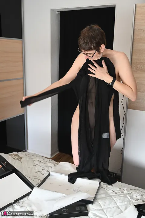 European MILF in Lingerie and Glasses Poses While Dressing – photo 13 of 16