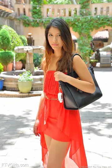 Asian Brunette in a Skirt and Heels Flashes Her Shaved Pussy Outdoors