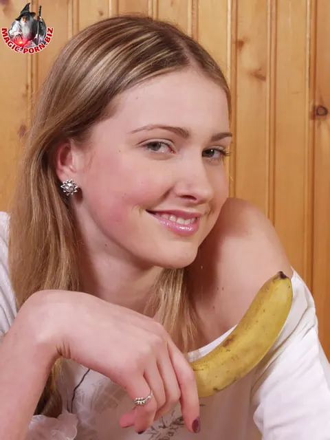 Woman in White Stockings Strips, Eats a Banana, and Uses a Dildo – photo 6 of 17
