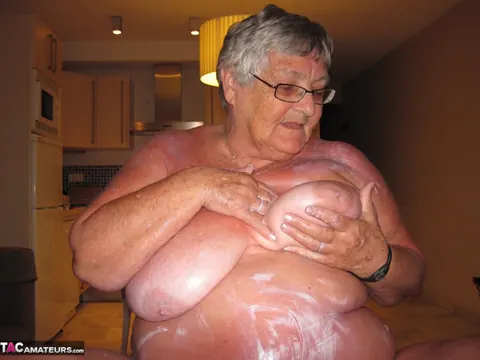 Busty Brunette in Glasses Oils Her Tits and Spreads – photo 20 of 20