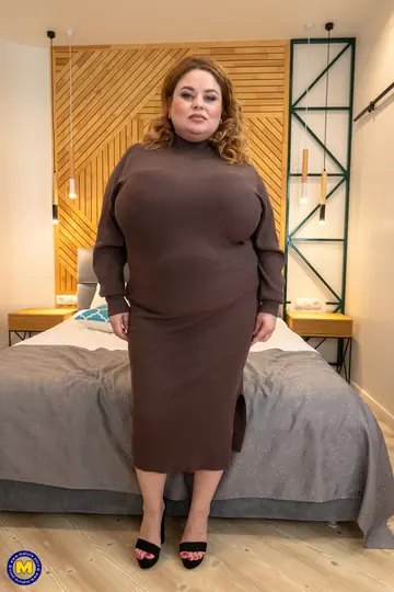 European MILF with Big Tits Strips Out of Her Skirt on the Bed