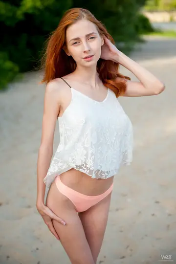 Slim European Redhead Reveals Her Big Natural Tits and Spreads on the Beach