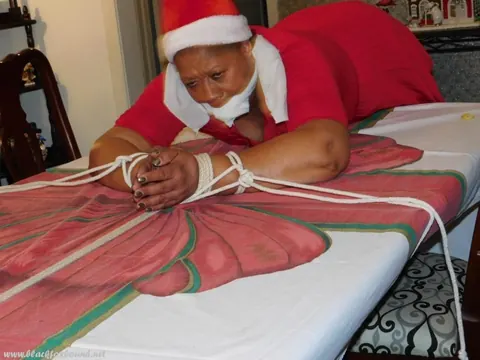 Mature Ebony Woman Tied Over a Table at Christmas in Panties – photo 7 of 16