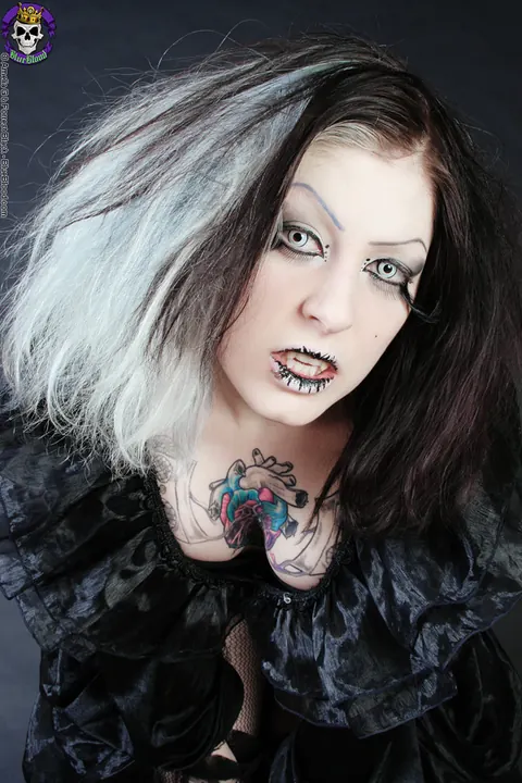 Tattooed Woman in Stockings and Costume Exposes Herself – photo 1 of 15