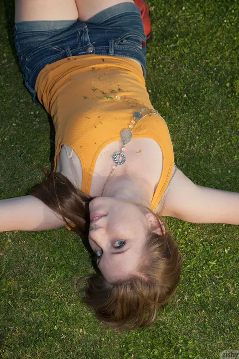 Athletic Brunette Shows Off Her Legs in Shorts and Boots Outdoors – photo 4 of 11