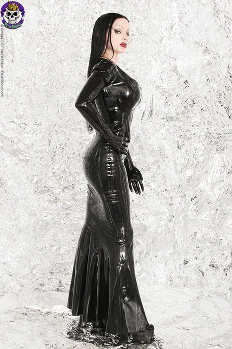 Brunette with Big Tits Unzips Her Latex Dress and Frees Her Breasts – photo 12 of 18