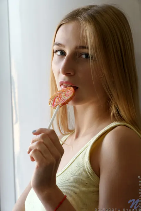 Elizabeth Evans: Blonde in Socks Fingers Her Shaved Pussy – photo 1 of 20