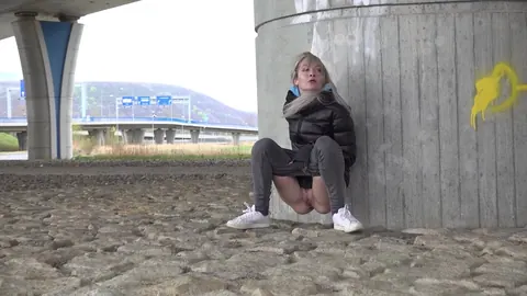 European Blonde Squats in Jeans and Pisses Outdoors – photo 3 of 15