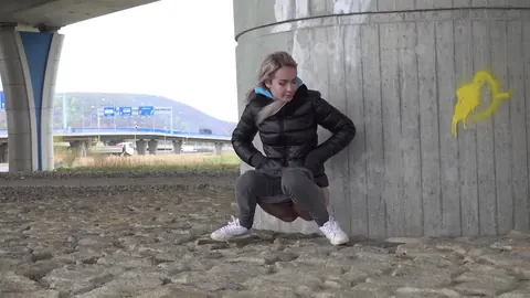 European Blonde Squats in Jeans and Pisses Outdoors – photo 11 of 15