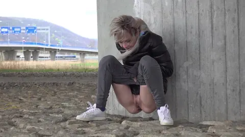 European Blonde Squats in Jeans and Pisses Outdoors – photo 4 of 15