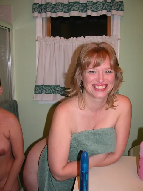 April Showers: Mature Blonde Lesbians Use a Dildo in the Bathroom – photo 1 of 21