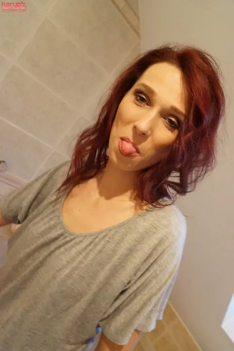 Breanne Tozeva: Curly Redhead Strips Off Her Panties to Masturbate in the Bathroom – photo 3 of 20