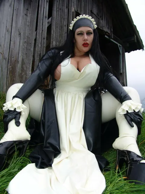 Ginger Mi: Brunette MILF with Big Tits Does Laundry in Latex Uniform Outdoors – photo 12 of 16
