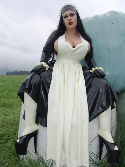 Ginger Mi: Brunette MILF with Big Tits Does Laundry in Latex Uniform Outdoors – photo 2 of 16