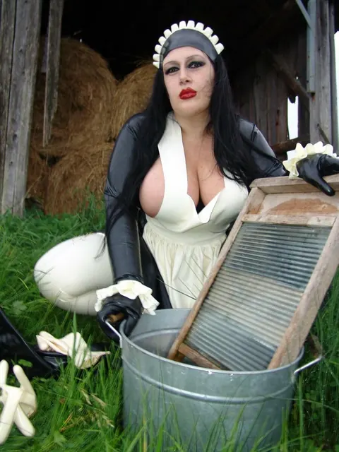 Ginger Mi: Brunette MILF with Big Tits Does Laundry in Latex Uniform Outdoors – photo 6 of 16