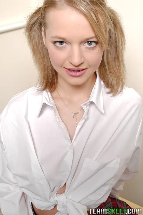 Slim Blonde in Pigtails Pulls Her Panties Aside and Spreads Her Pussy – photo 2 of 21