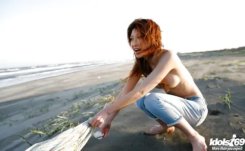 Yu Satome: Japanese Brunette Reveals Her Big Tits on the Beach – photo 10 of 14