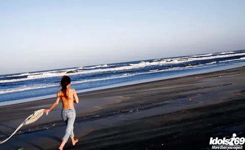 Yu Satome: Japanese Brunette Reveals Her Big Tits on the Beach – photo 13 of 14