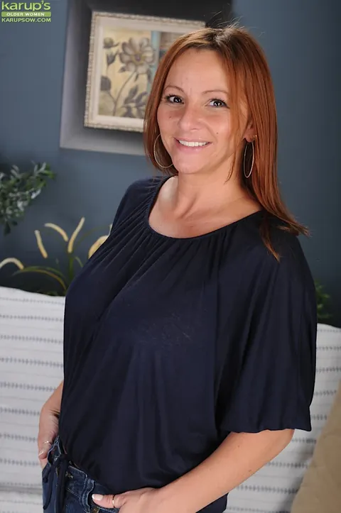 Gia Sophia: Mature Redhead with Big Tits Strips Out of Her Jeans – photo 1 of 16