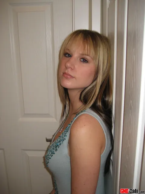 Blonde in a Dress and Heels Frees Big Tits and Squeezes Them – photo 9 of 12