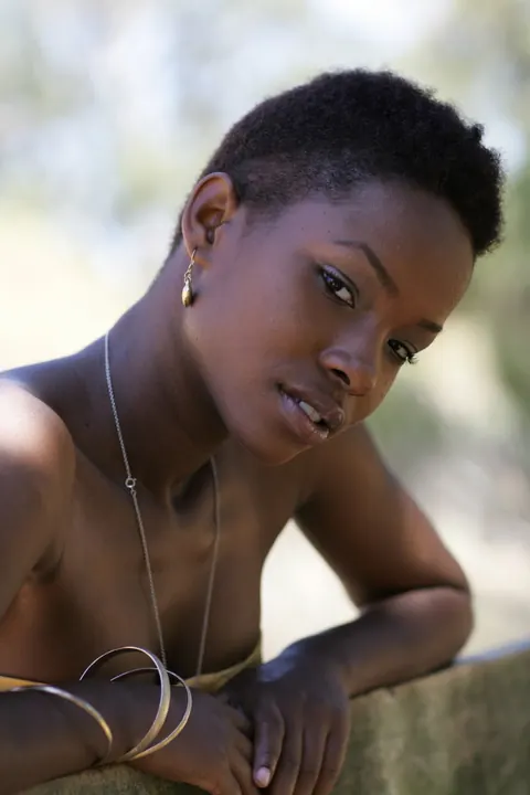 Ebony Woman with Short Hair Poses Fully Clothed – photo 17 of 20