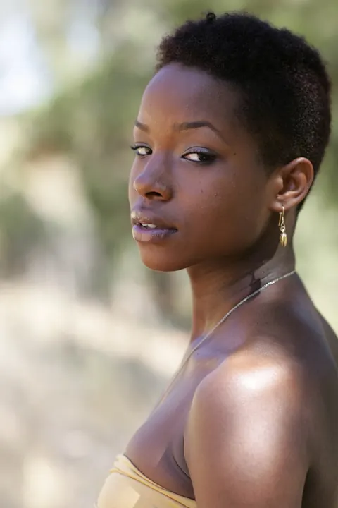 Ebony Woman with Short Hair Poses Fully Clothed – photo 11 of 20