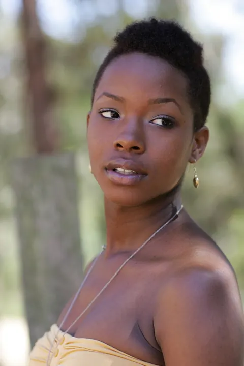 Ebony Woman with Short Hair Poses Fully Clothed – photo 10 of 20