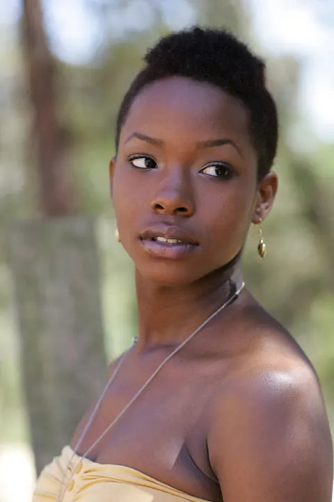 Ebony Woman with Short Hair Poses Fully Clothed – photo 9 of 20