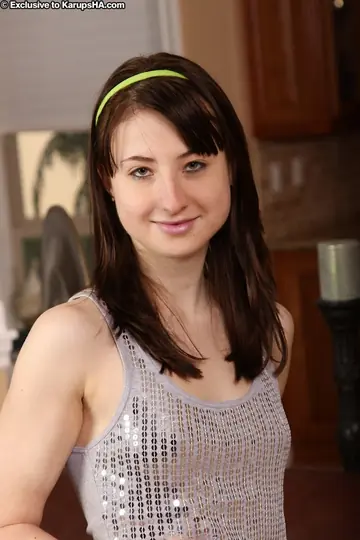 Woman Undresses and Poses for the Camera