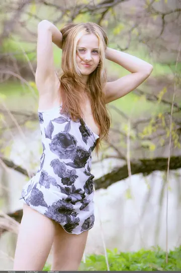 Woman Undresses and Poses Nude in Glamour Style