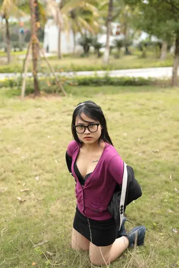 Petite Asian Babe with Big Tits Poses Outdoors in Glasses
