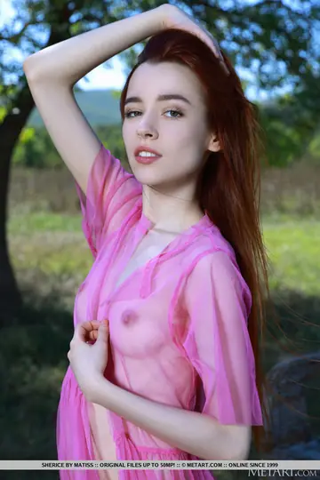 Redhead Strips Naked Under a Shade Tree