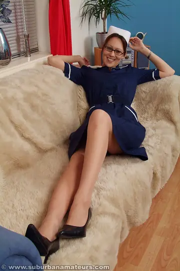 Short-Haired Brunette in Glasses Fingers Her Pussy in Lingerie