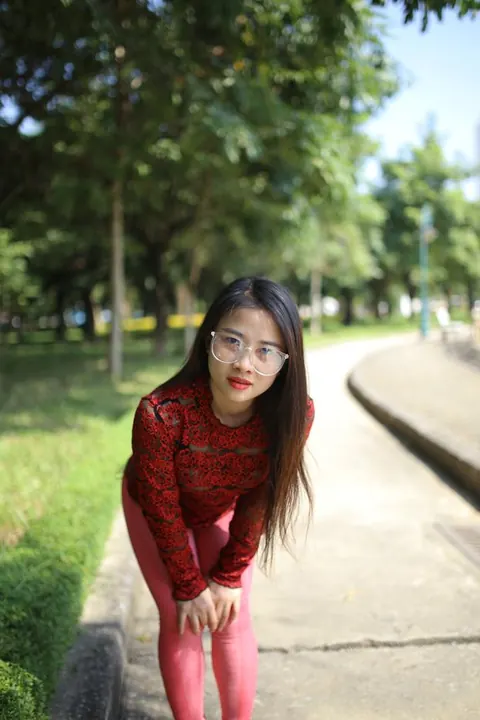 Asian Brunette in Yoga Pants and Glasses Poses Outdoors – photo 2 of 21