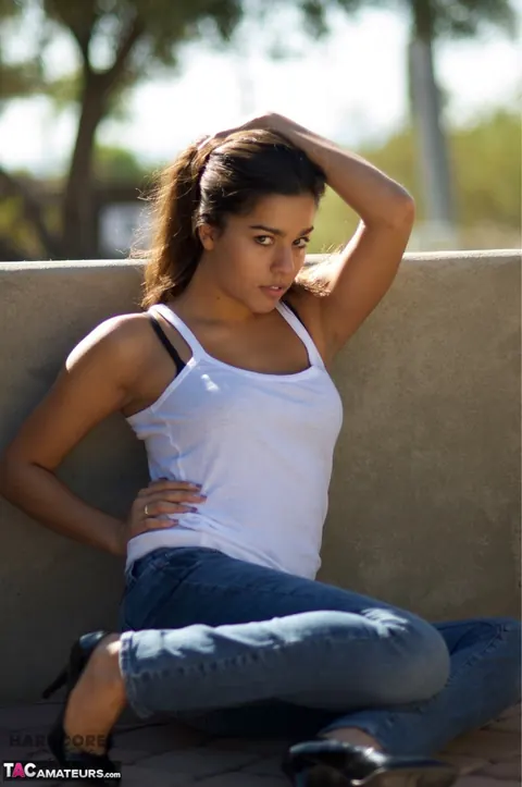 Busty Brunette in Jeans and High Heels Spreads Outdoors – photo 14 of 16
