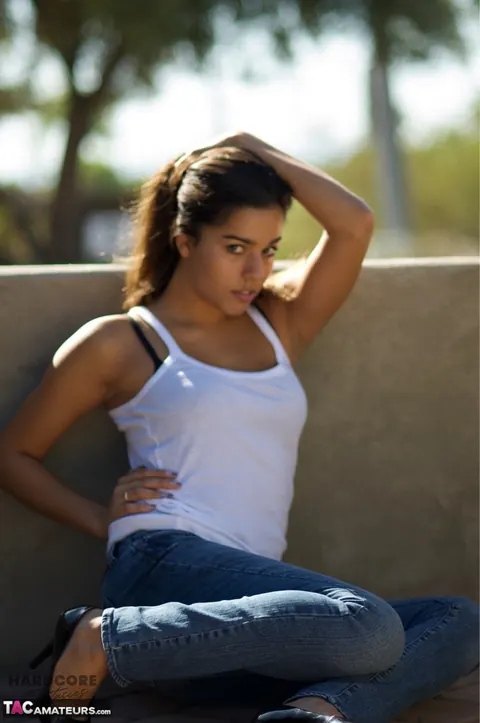 Busty Brunette in Jeans and High Heels Spreads Outdoors – photo 15 of 16
