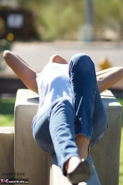 Busty Brunette in Jeans and High Heels Spreads Outdoors – photo 5 of 16
