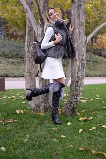 Woman Poses and Shows Her Figure from the Side