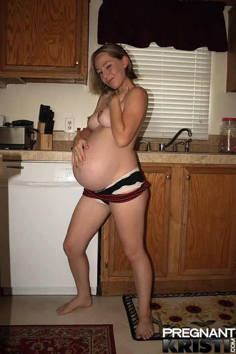 Thick Pregnant Babe Strips Out of Her Tube Top in the Kitchen – photo 10 of 16