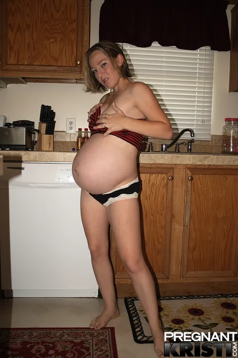Thick Pregnant Babe Strips Out of Her Tube Top in the Kitchen – photo 6 of 16