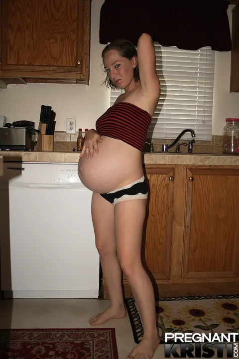 Thick Pregnant Babe Strips Out of Her Tube Top in the Kitchen – photo 3 of 16