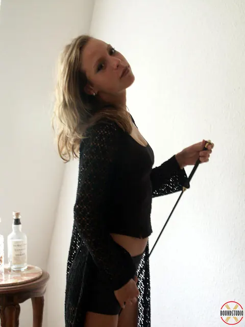 Blonde in Leather Shorts and High-Heeled Boots Wields Whip – photo 10 of 16