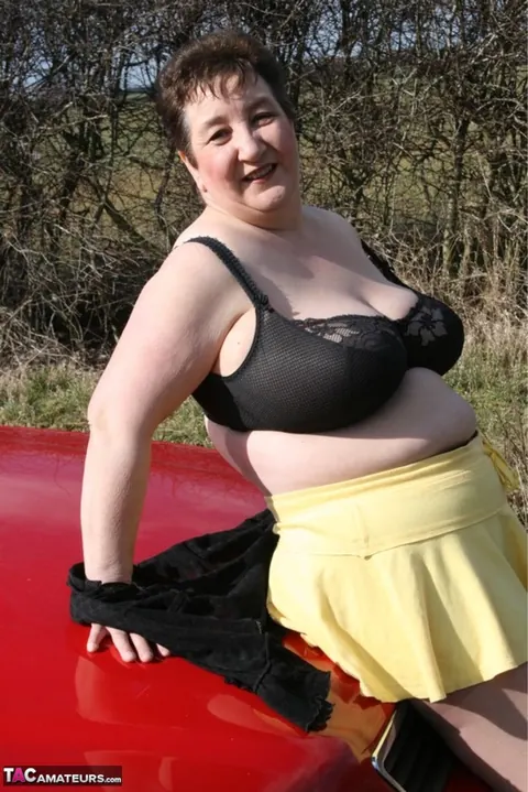 Kinky Carol: British MILF in Pantyhose Strips Outdoors in a Skirt and Heels – photo 15 of 16