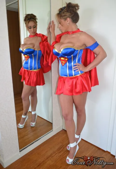 Eva Notty: Tattooed Brunette MILF Strips Off Her Superman Costume – photo 10 of 15